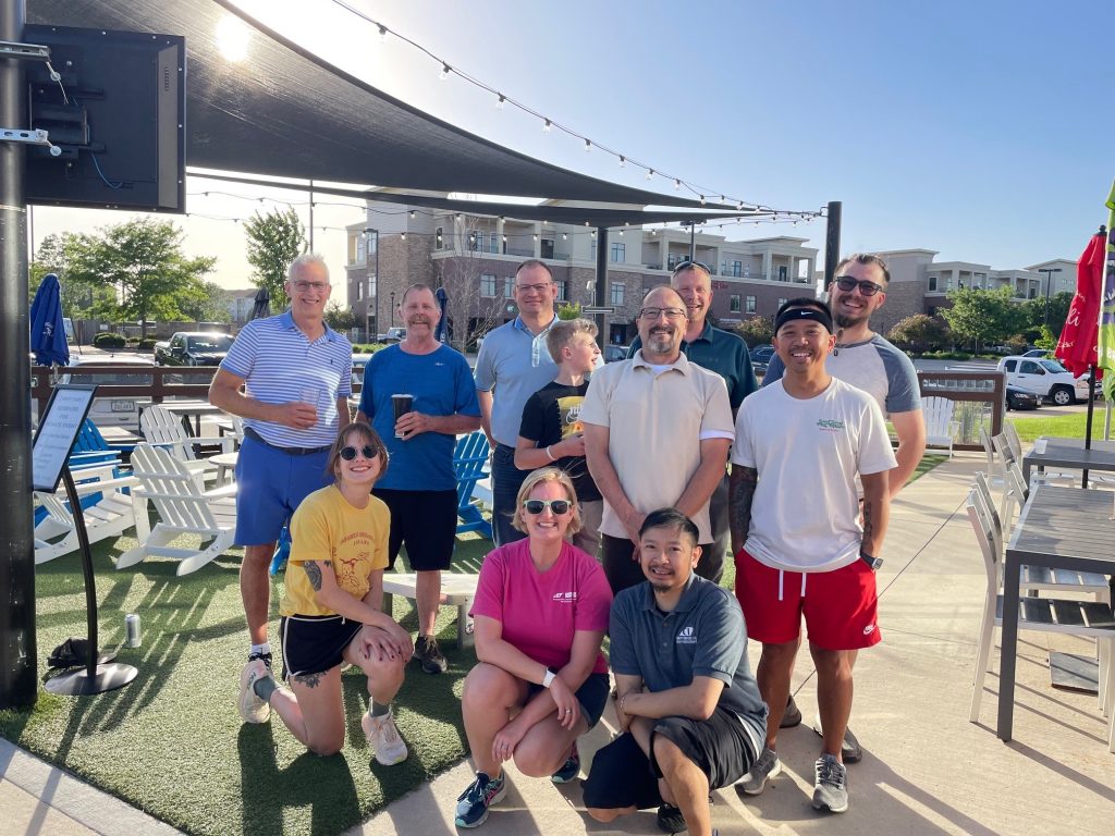 Team photo of LBS employees outside