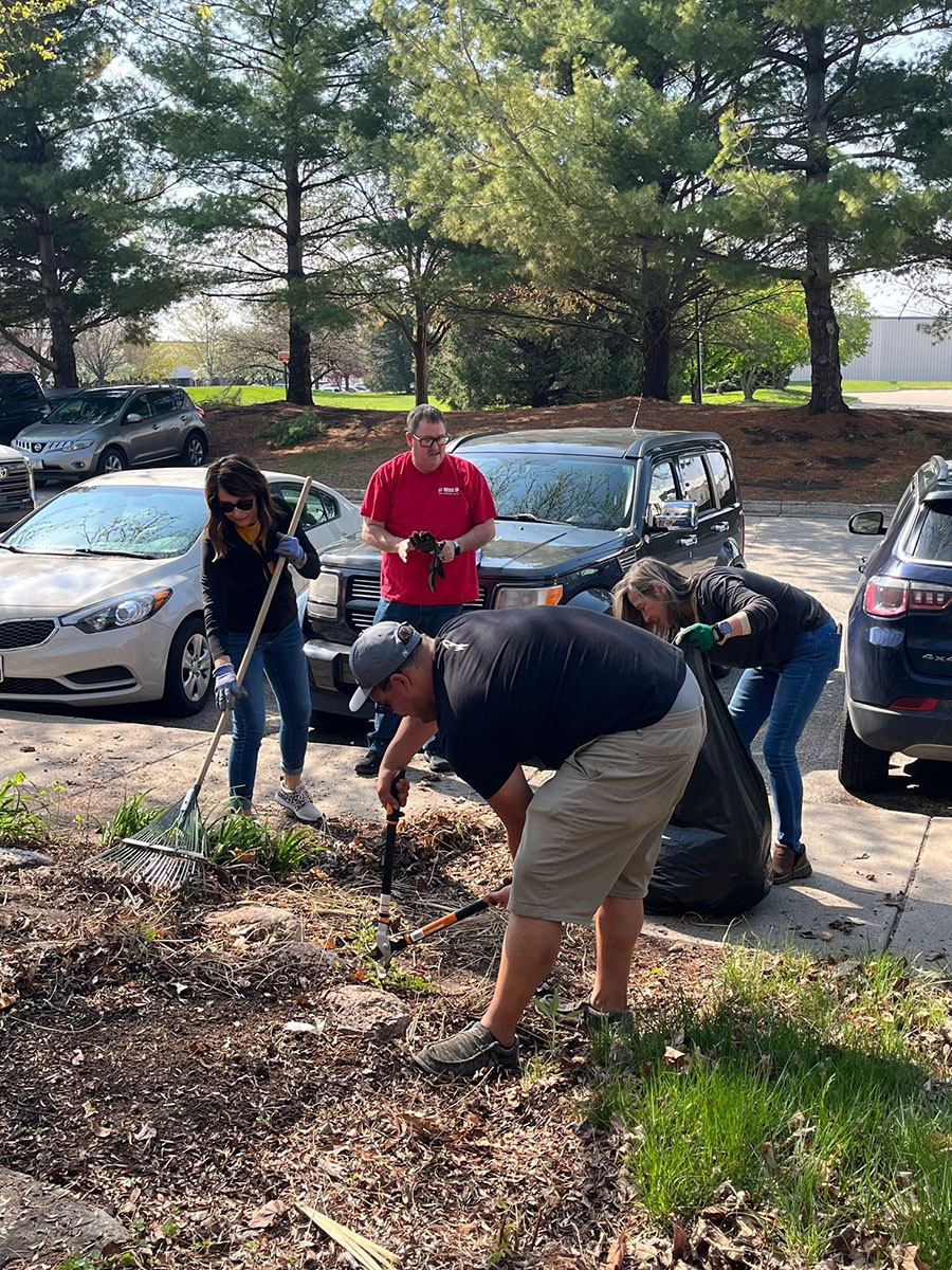 LBS employees raking