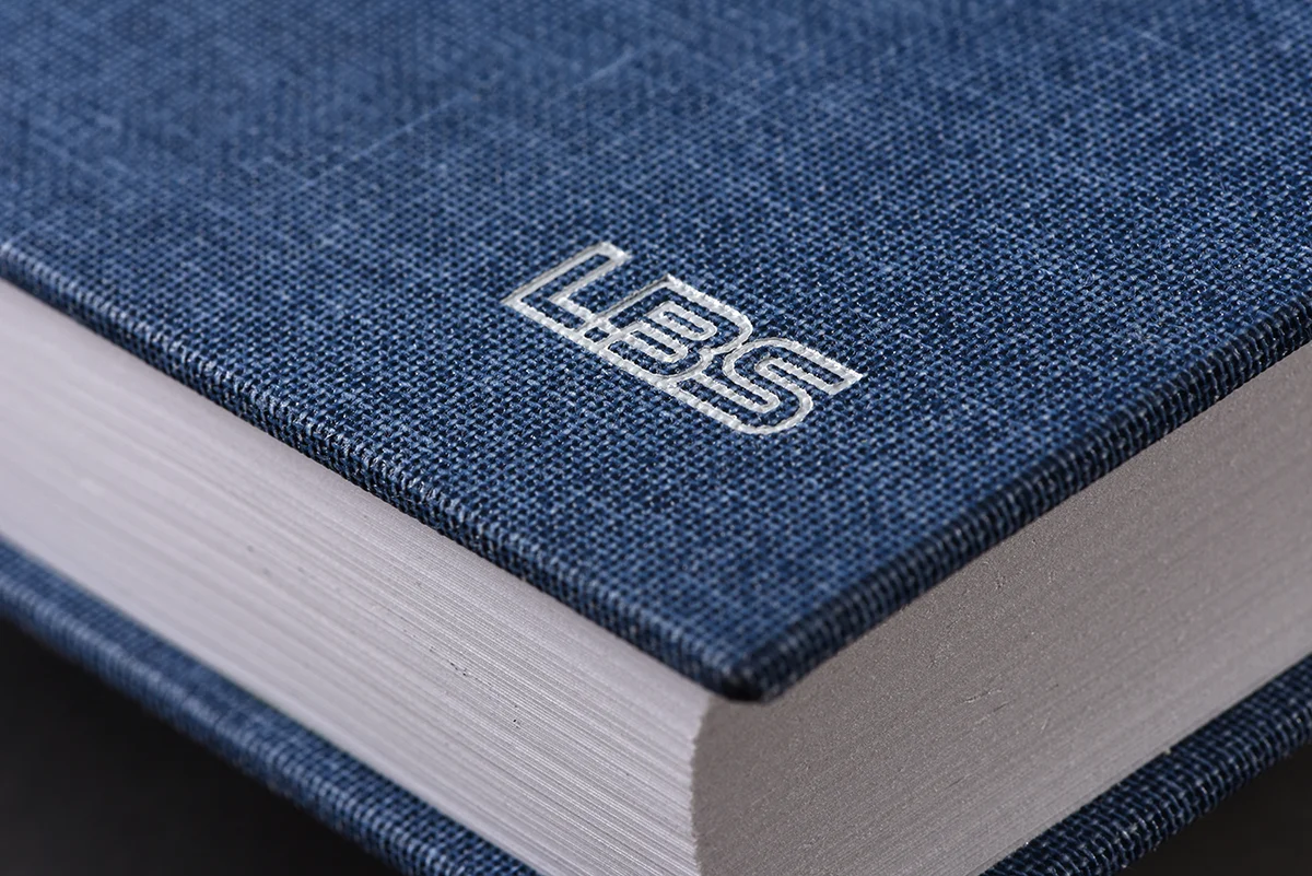 Close-up view of book cover with LBS engraving in corner